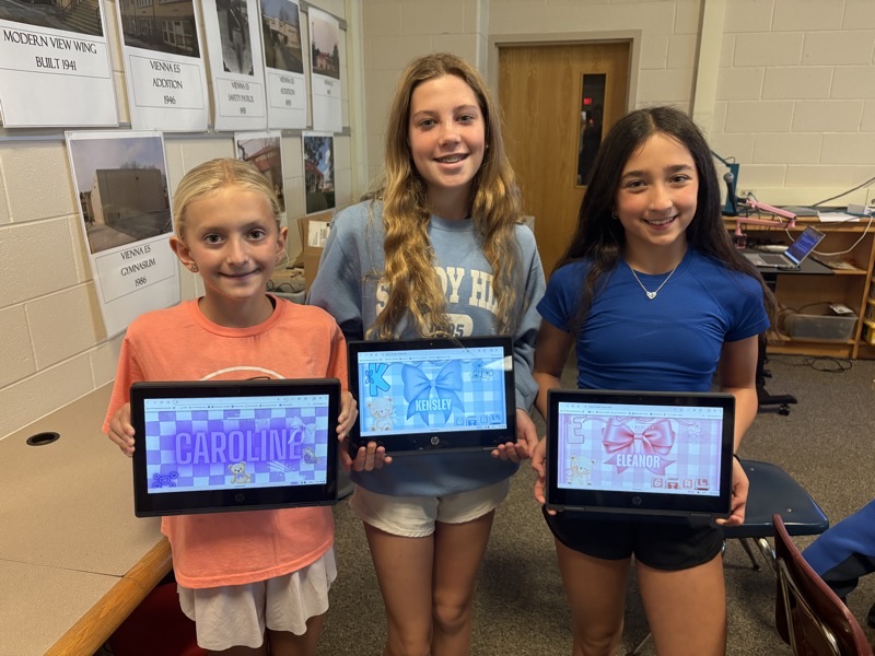 Students showcasing digital graphic design projects in the i.Lab pilot